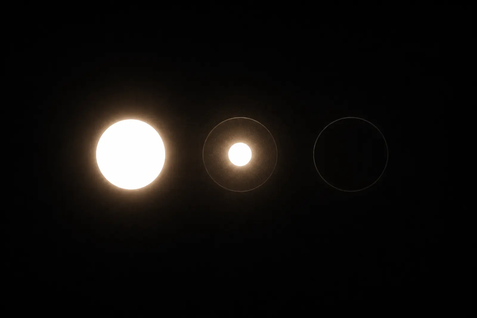 Three referee lights in a row: one fully lit, one flickering to life, one still dark.